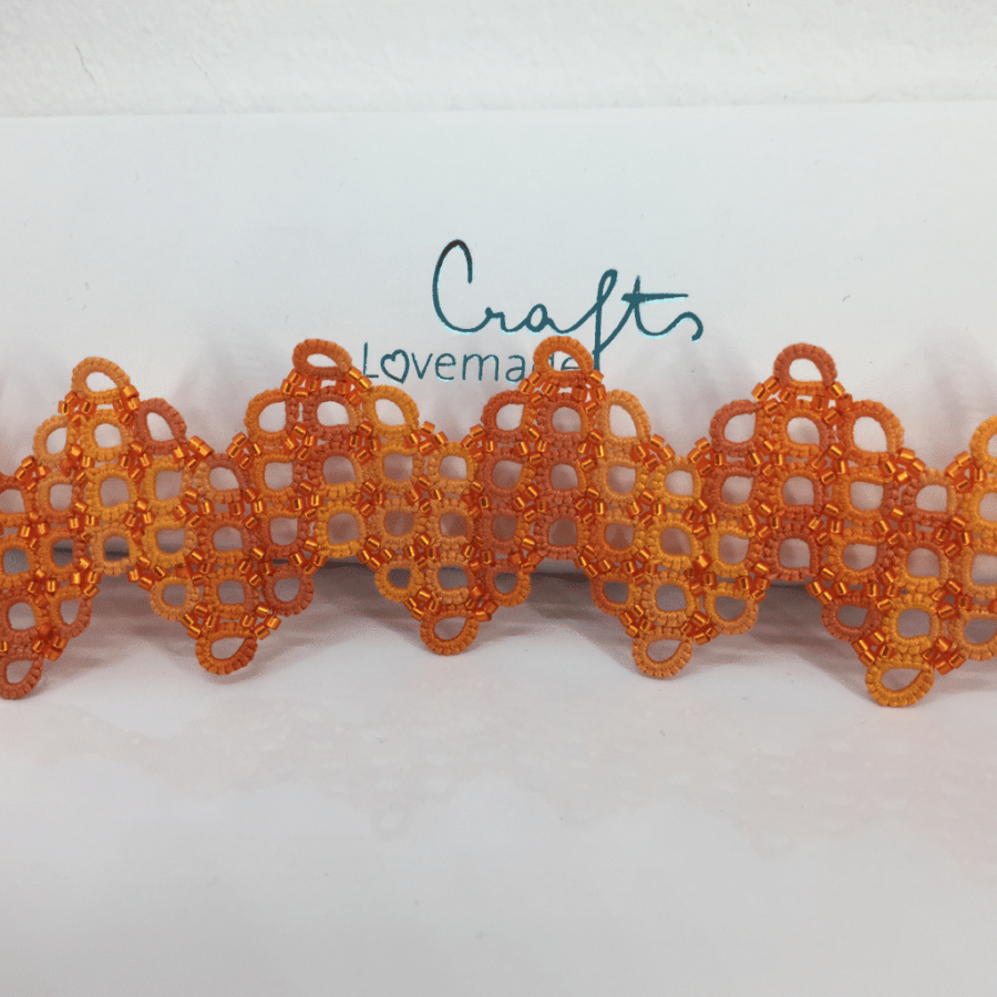 LMC Armband criss cross orange quer